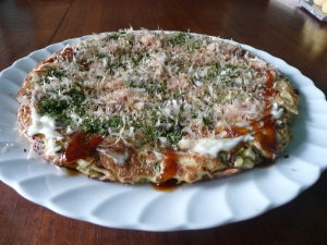 Piping hot Okonomiyaki with traditional toppings